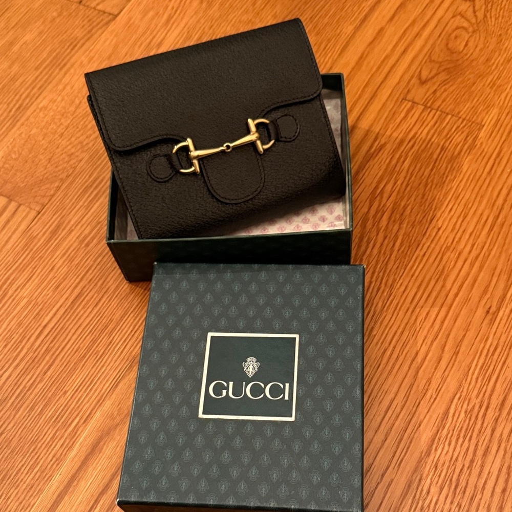 Gucci black compact wallet.
